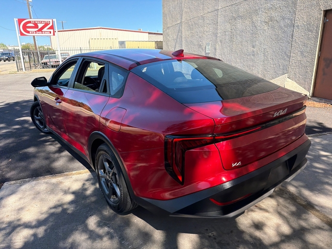 2025 Kia K4 LXS red rear quarter view driver side VIN 3KPFT4DE7SE033635 Dallas TX