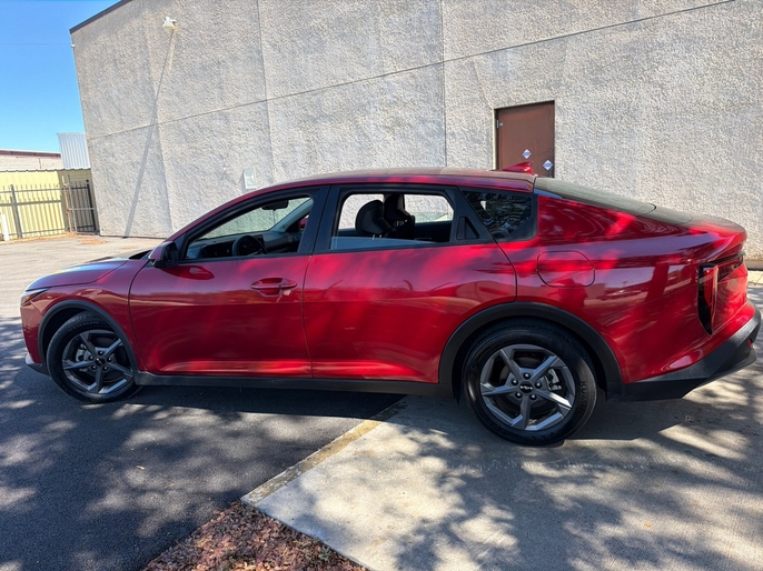 2025 Kia K4 LXS red driver side profile VIN 3KPFT4DE7SE033635 Dallas TX